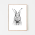 Framed pencil sketch of rabbit with a bow.