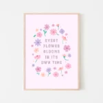 “every flower blooms in its own time” inspirational quote with floral design in pastel colours - timber frame