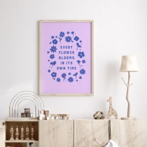 “every flower blooms in its own time” inspirational quote with floral design in blue hues