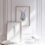 Framed rabbit and feather art with modern decor.