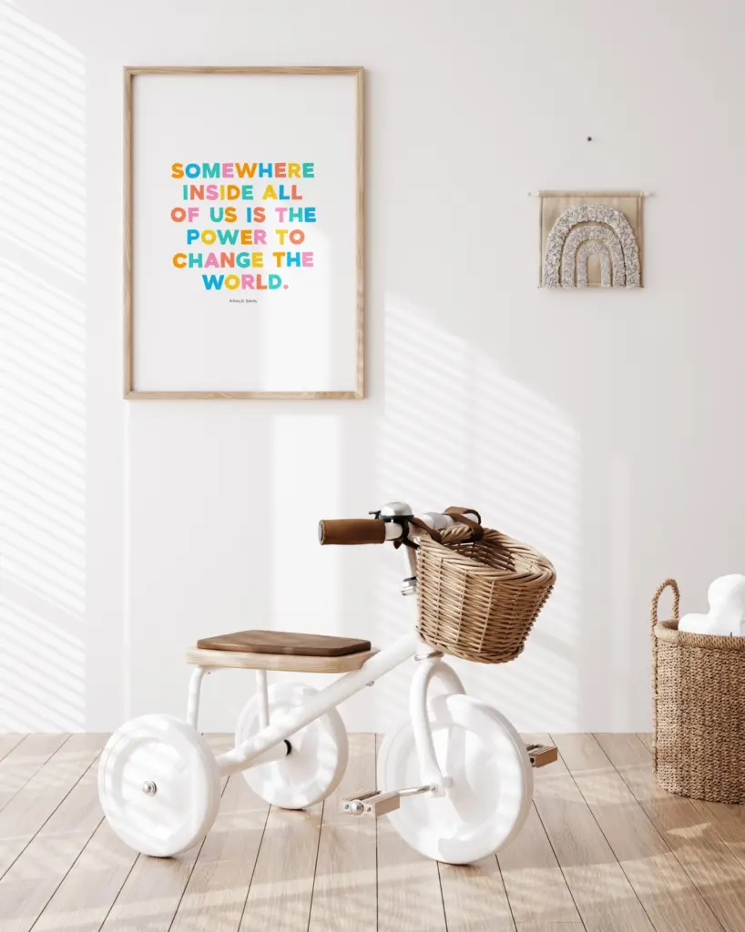 Minimalist kids room with tricycle and wall art